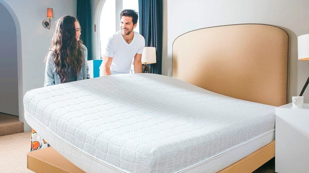 How Can We Extend the Lifespan of a Room Mattress? A couple moving a room mattress