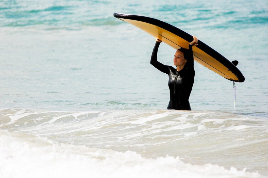 Riding the Wave of Relaxation: The Advantages of Costa Rica Surf Hotels” amazing view beautiful girl stands with surfboard ocean shore 72229 1205